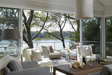 Example of a mid-sized danish formal and enclosed light wood floor and brown floor living room design in New York with white walls, no fireplace and no tv