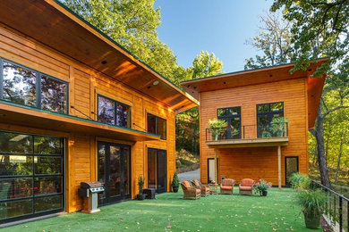 Example of a huge mountain style two-story exterior home design in Calgary
