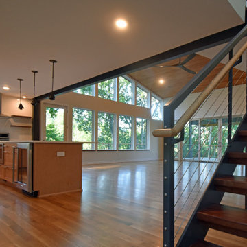 From the entry - stairs and kitchen embrace the entry into the great room