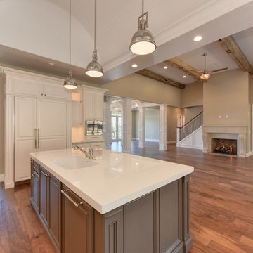 Kitchen view into the family room showing the antique beams and the barrel bead