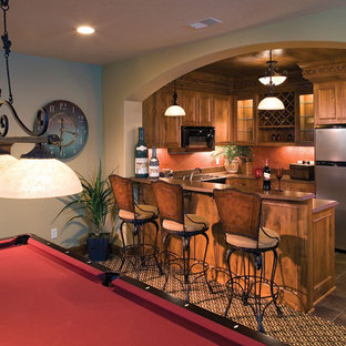 Design ideas for a classic fully buried basement in St Louis with orange walls, no fireplace and multi-coloured floors.