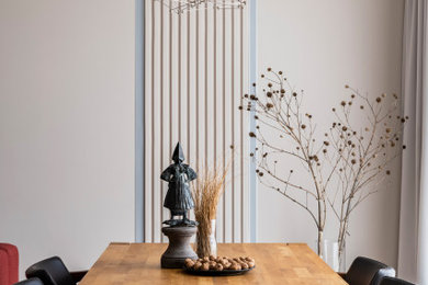 This is an example of a medium sized contemporary open plan dining room in Other with beige walls, porcelain flooring, beige floors and panelled walls.