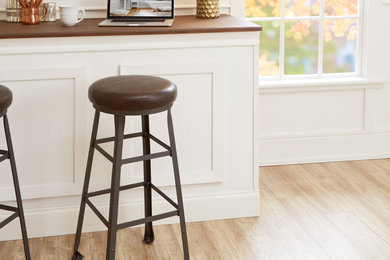 Inspiration for a transitional single-wall seated home bar remodel in Other