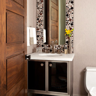 Powder room - transitional gray floor powder room idea in Denver with furniture-like cabinets, beige walls, an undermount sink and white countertops