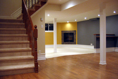 Basement - large contemporary underground dark wood floor basement idea in Ottawa with gray walls and no fireplace