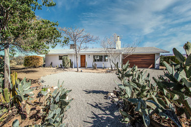 Inspiration for a contemporary white exterior home remodel in Other