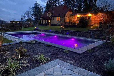 Inspiration for a large modern backyard concrete paver and rectangular pool landscaping remodel in Vancouver