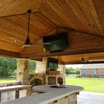 Prosper - Freestanding patio with outdoor kitchen, fireplace and firepit.