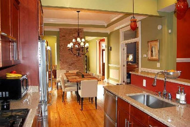 Inspiration for an eat-in kitchen remodel in Nashville with an undermount sink, medium tone wood cabinets, quartz countertops and stainless steel appliances