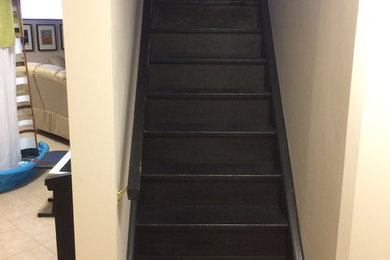 Mid-sized minimalist wooden straight wood railing staircase photo in Toronto with wooden risers
