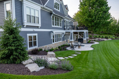 Inspiration for a traditional backyard landscaping in Milwaukee.
