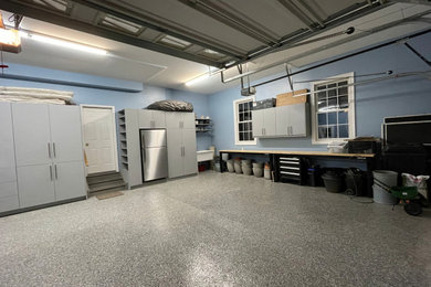 Open shelving, work benches, rolling tool carts, wall storage, and slop sink.