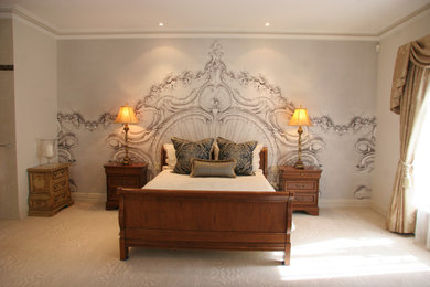 Inspiration for a large traditional master bedroom in Perth with white walls, carpet, beige floor and wallpaper.