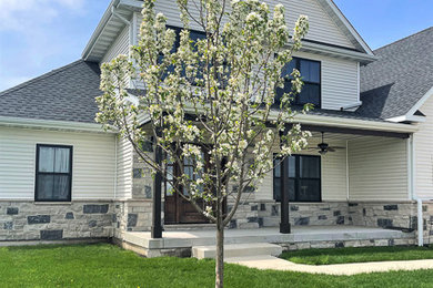 This is an example of a small traditional full sun front yard landscaping in Chicago for spring.