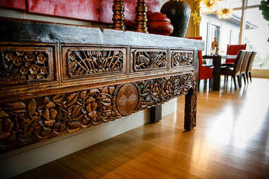 Inspiration for a mid-sized asian medium tone wood floor entryway remodel in Other with beige walls