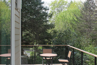 Example of a trendy backyard deck design in New York