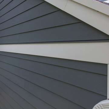Shiny new Andersen Windows, Evening Blue James Hardie siding & stone accents