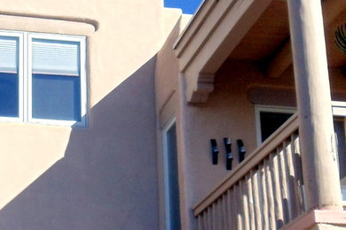 Photo of a transitional home design in Albuquerque.