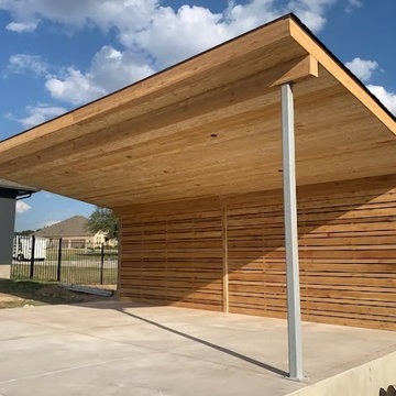 Cover patio with a privacy fence with tongue and groove ceiling