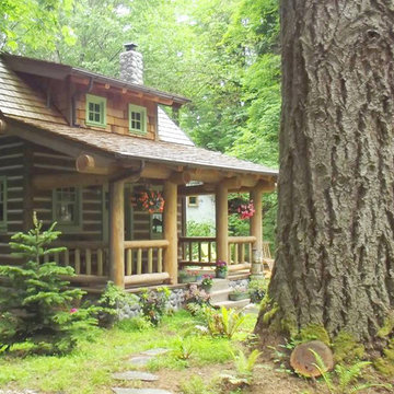 Hand Hewn Log Siding Cabin in Spring.
