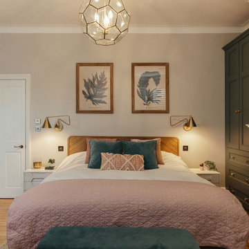 Soft pink and blue master bedroom with recessed storage