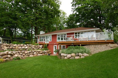 Mid-sized red two-story exterior home photo in Minneapolis
