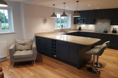 Stunning Dark Blue Shaker kitchen, Oak flooring and quarts work tops