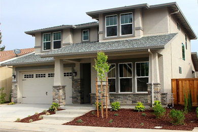 Example of a mid-sized classic beige two-story mixed siding exterior home design in Sacramento with a shingle roof