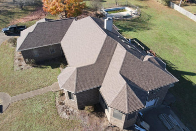 Inspiration for a house exterior remodel in Nashville with a hip roof, a shingle roof and a brown roof