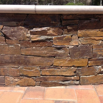 Pool with Copper Loose Stone Veneer and Pavers