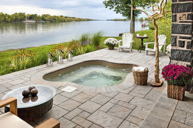 Inspiration for a small craftsman backyard concrete paver and custom-shaped hot tub remodel in Other