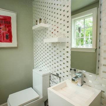 Magical Powder Room achieved with marble/mirror tile.