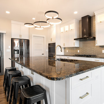 Beautiful Contemporary Kitchen w/ Dark Granite Countertops and Modern Lighting