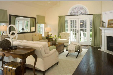 Inspiration for a large transitional open concept dark wood floor family room remodel in Bridgeport with beige walls, a standard fireplace and a wood fireplace surround