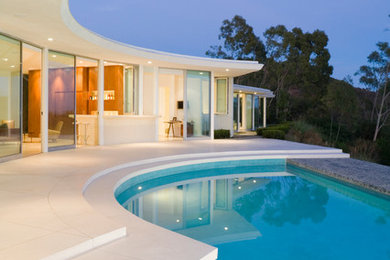 Trendy pool photo in Los Angeles