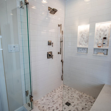 Luxury Spa Bathroom with Natural Warm Vanities, Quartz Countertop, Tiled Shower