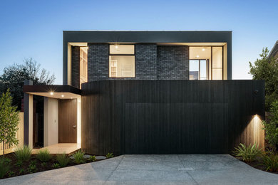 Photo of a large contemporary two-storey house exterior in Melbourne.