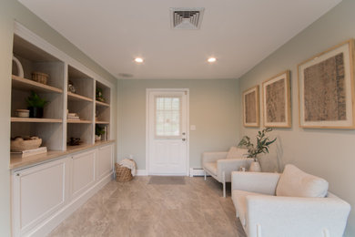 Inspiration for a brown floor mudroom remodel in Providence with green walls