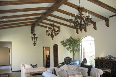 Large formal and open concept marble floor living room photo in Phoenix with white walls, a standard fireplace, a stone fireplace and a media wall