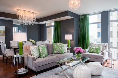 Example of a transitional open concept medium tone wood floor living room design in DC Metro with gray walls and no fireplace