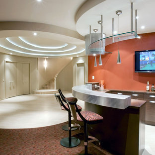 This is an example of a contemporary fully buried basement in Toronto with orange walls and carpet.