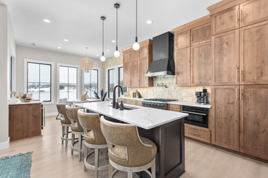 Eat-in kitchen - large rustic l-shaped eat-in kitchen idea in Richmond with a double-bowl sink, recessed-panel cabinets, quartz countertops, black appliances and an island