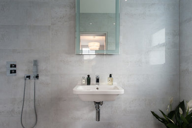 Design ideas for a contemporary bathroom in London with grey walls.