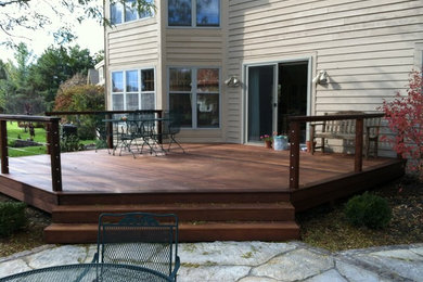 Design ideas for a large contemporary backyard deck in Milwaukee.