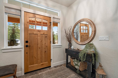 Entryway - rustic gray floor entryway idea in Other