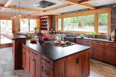 Example of a farmhouse kitchen design in Seattle with recessed-panel cabinets