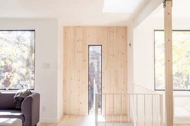 Living room - large contemporary open concept light wood floor living room idea in Montreal