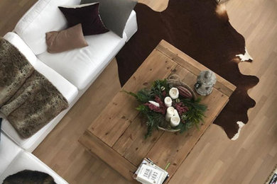 Inspiration for a large farmhouse light wood floor great room remodel in Berlin with white walls