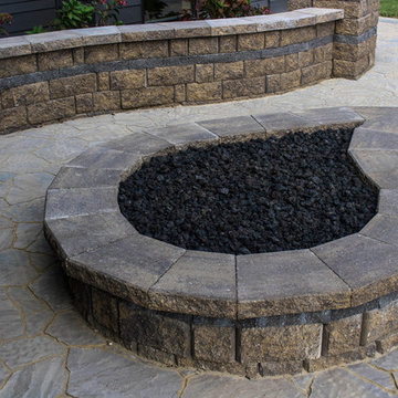 Tear Drop Fire Pit On Hand-Laid Paver Patio