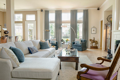 Inspiration for a mid-sized modern open concept travertine floor living room remodel in Houston with beige walls, a standard fireplace and a tile fireplace